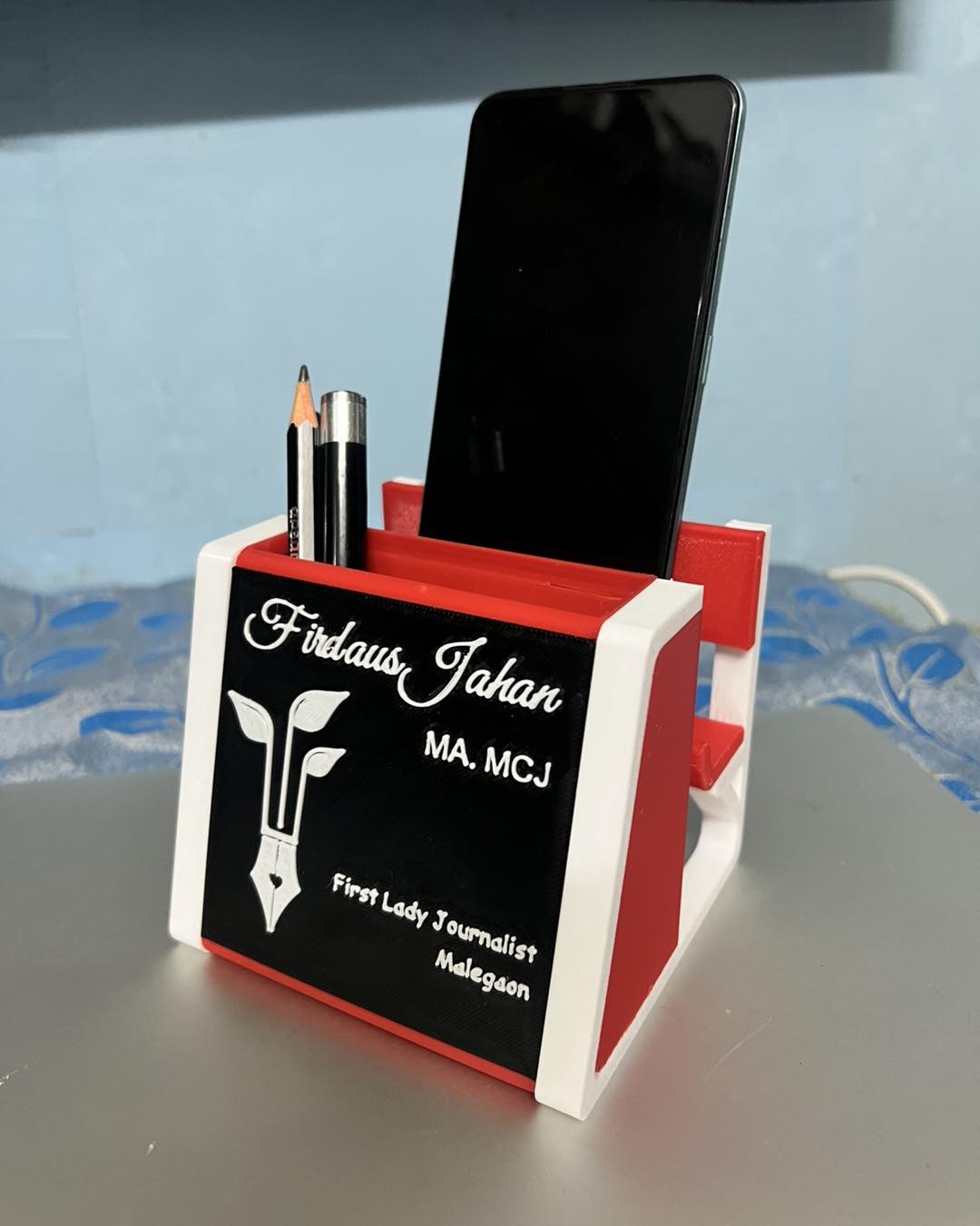 Personalised pen and mobile holder